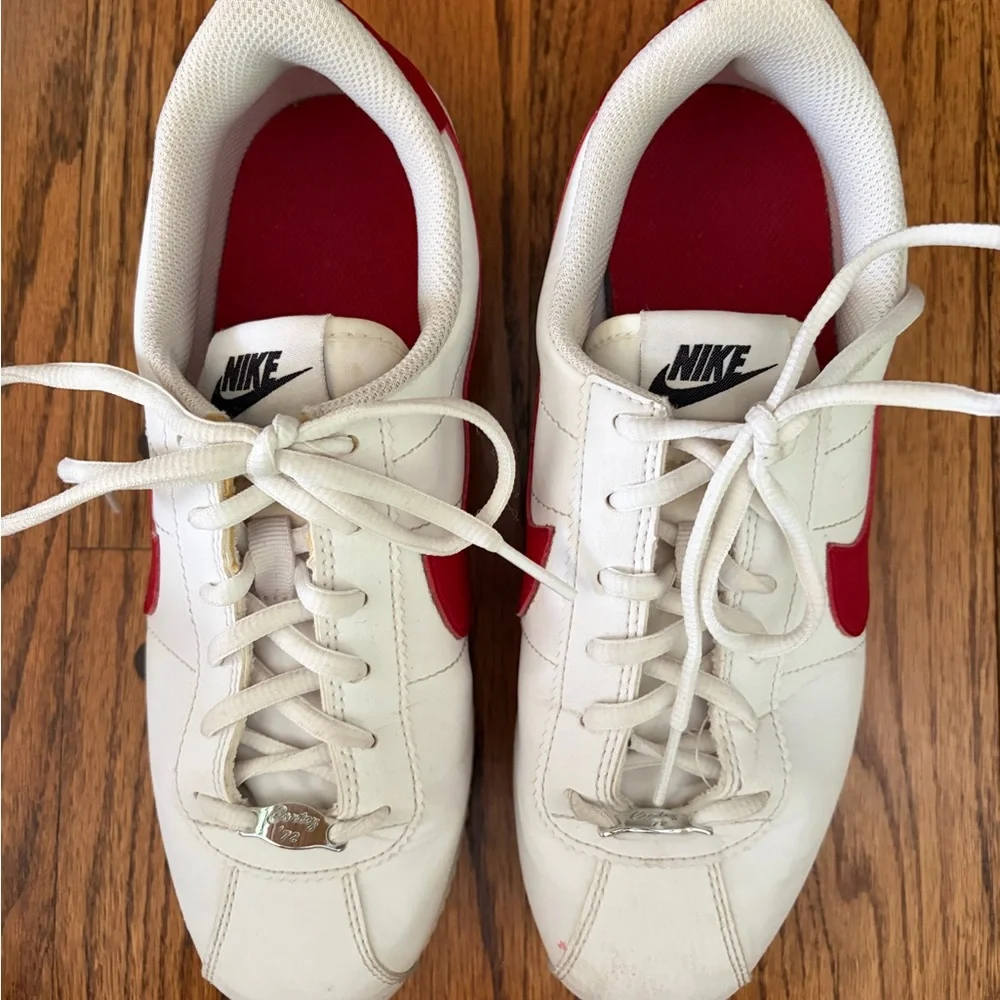 Nike Kids White Sneakers with Red Swoosh and Blue Accent - Size 7Y